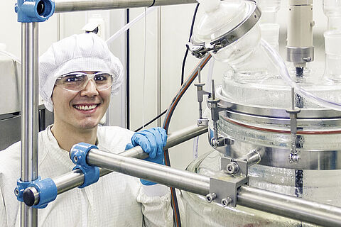 ChemCon production chemist in cleanroom with dedicated equipment